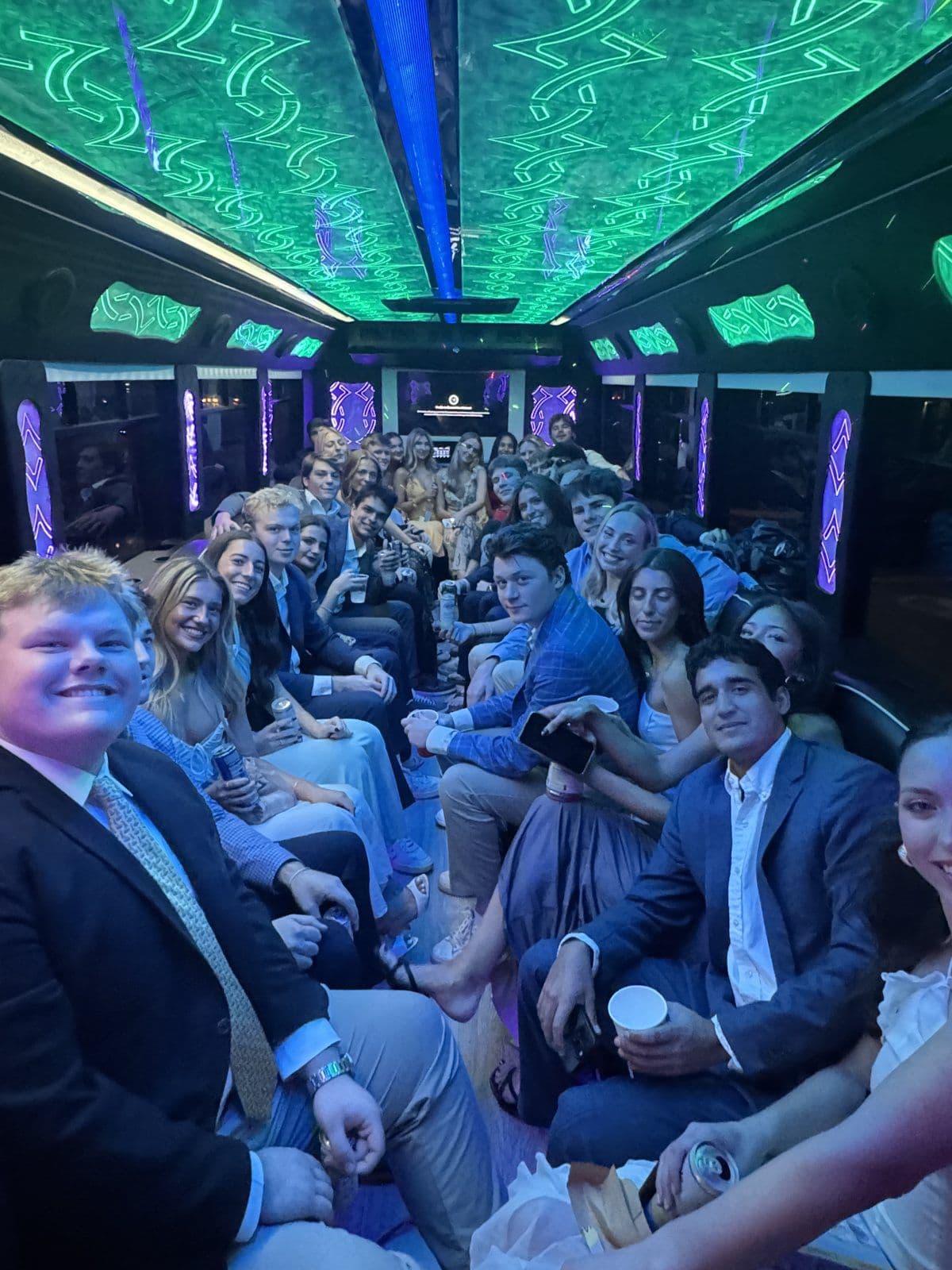 Fraternity formal group on a party bus